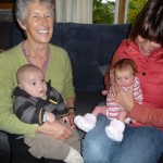 This is my Auntie Sonja holding me and my Cousin Khan sitting on my Gran Joyce